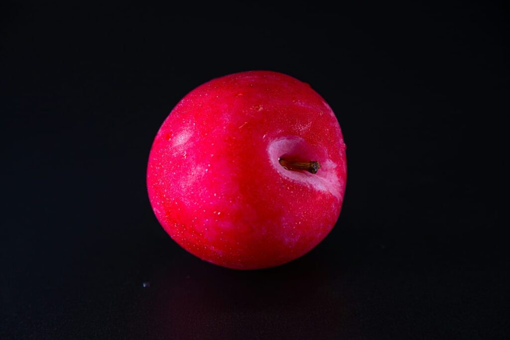 A red apple with a bite taken out of it