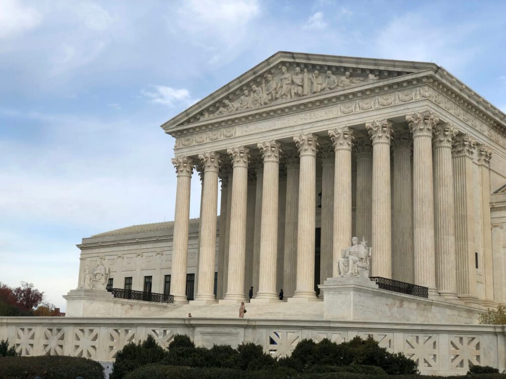 A large white building with columns and pillars