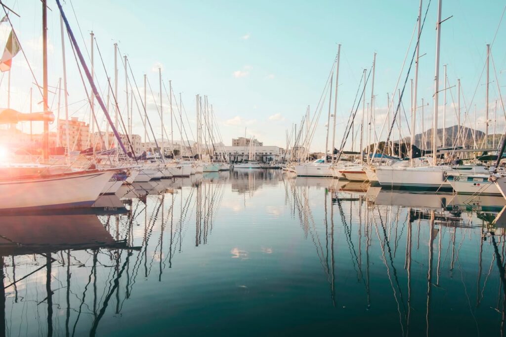 White sailboat in body of water during daytime